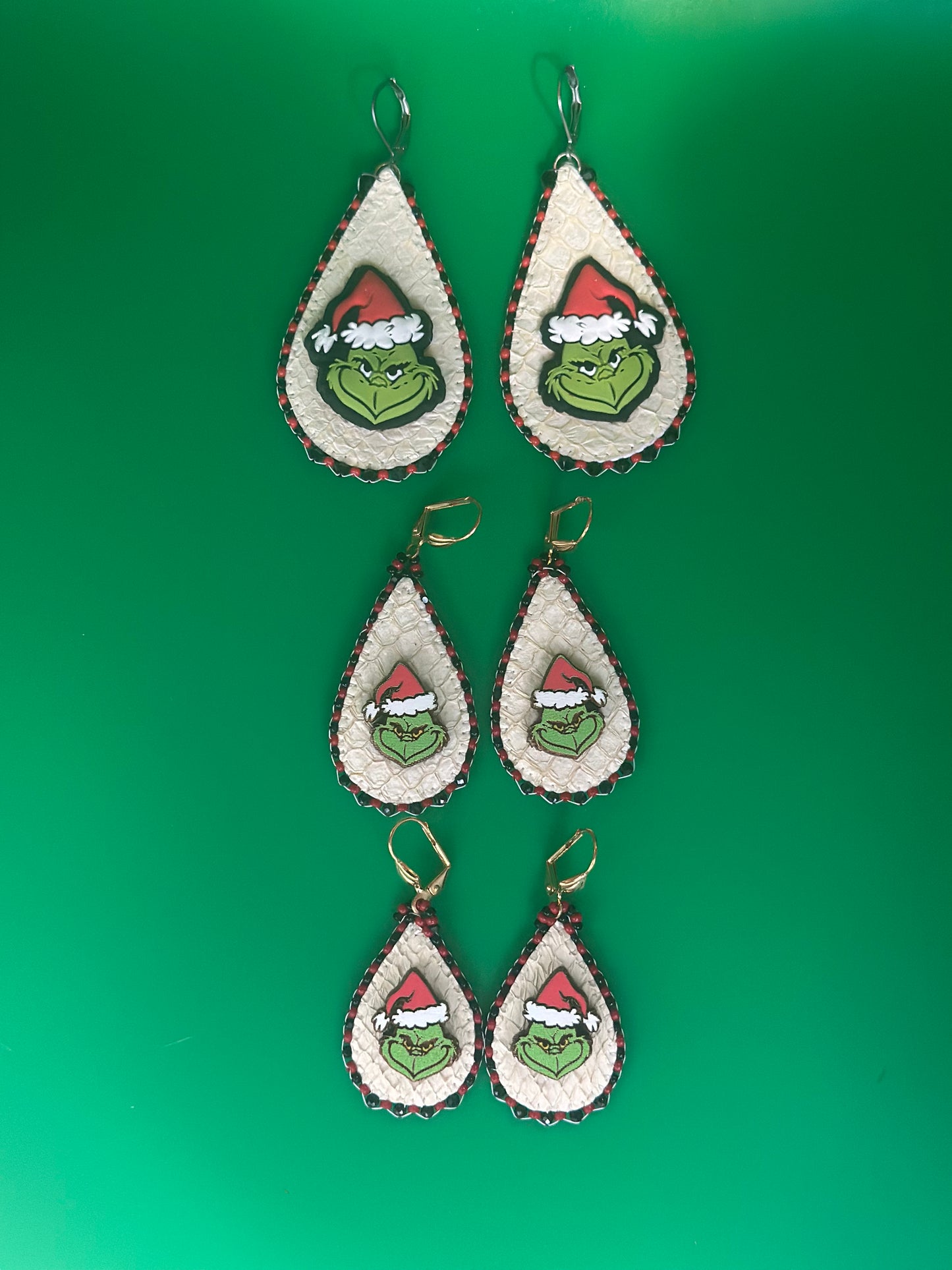 Large 100 medium 80.00 and small 70.00 grinches made with salmon skin. Surrounded by sparkling black crystals.