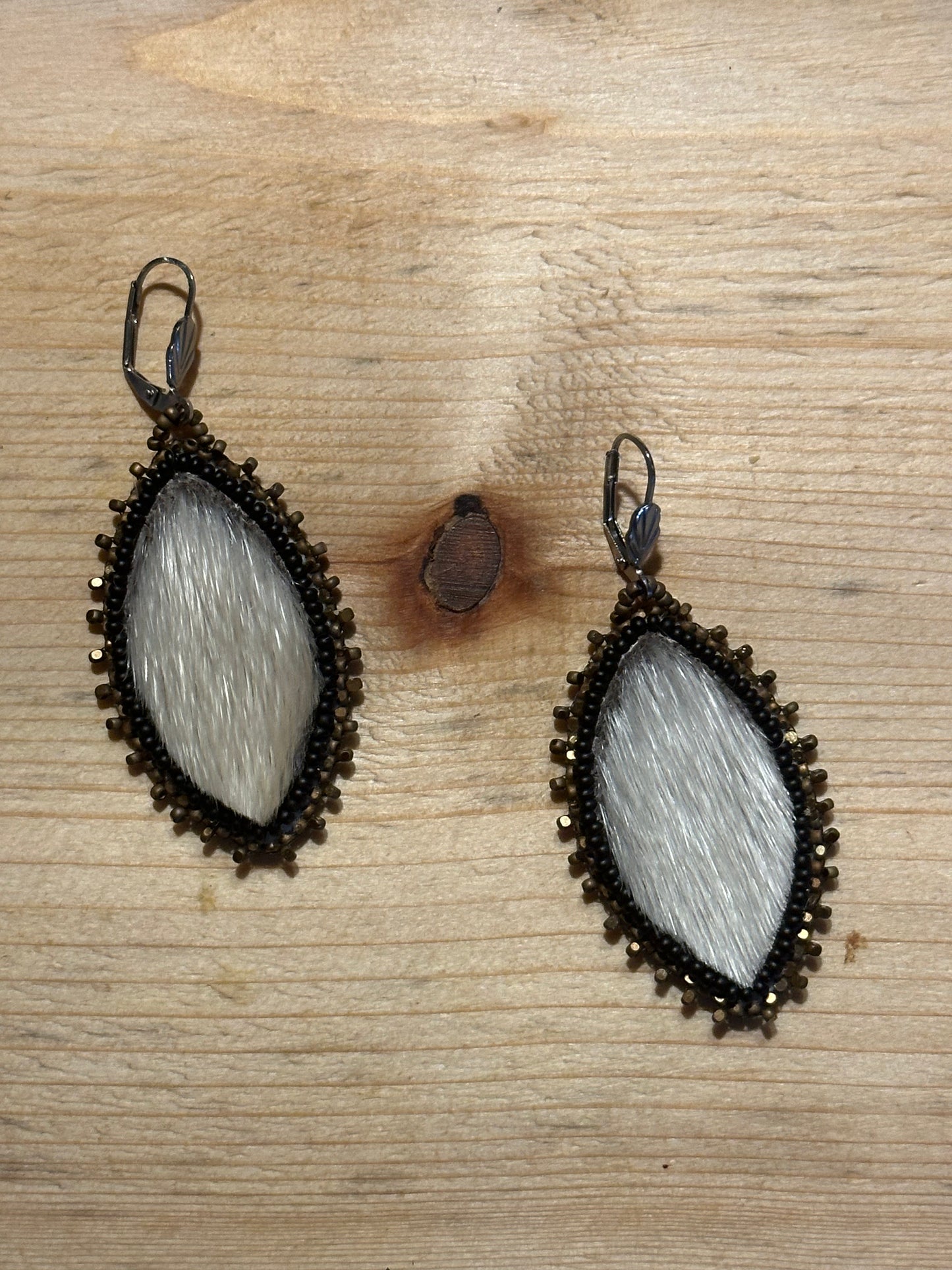 Seal fur surrounded in gold brown Charlotte beads.