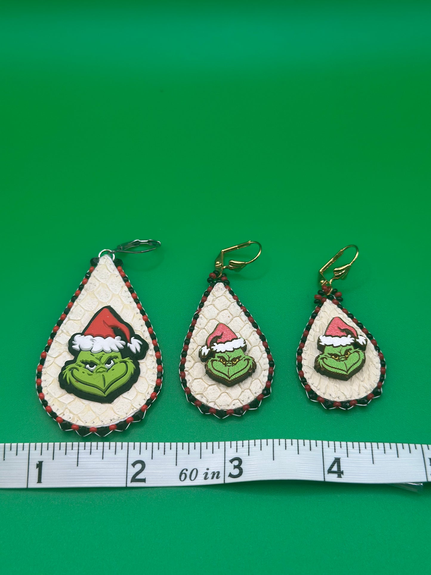 Large 100 medium 80.00 and small 70.00 grinches made with salmon skin. Surrounded by sparkling black crystals.