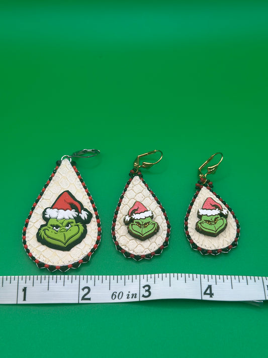 Large 100 medium 80.00 and small 70.00 grinches made with salmon skin. Surrounded by sparkling black crystals.